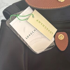 Longchamp Black Nylon Backpack with Brown Leather Trim and Gold Hardware